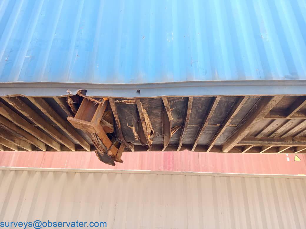 Observater Sudan marine surveyor inspecting container with a clipboard